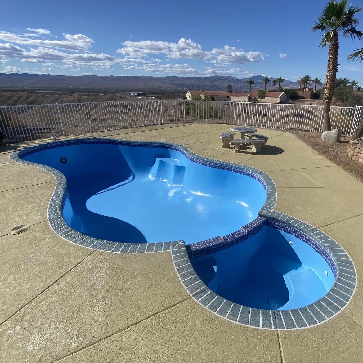 Luxury freeform swimming pool with spa