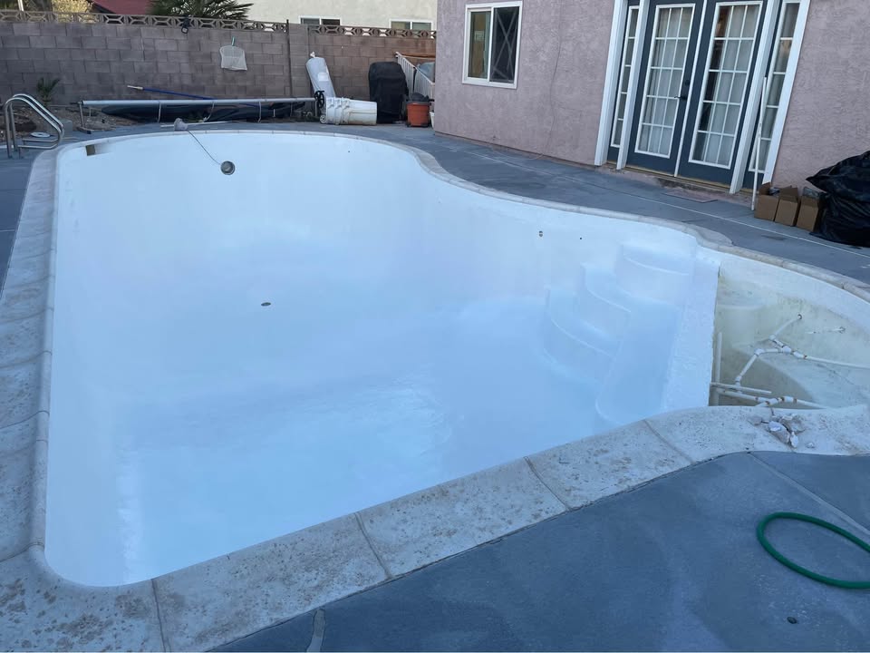 Empty pool being repaired