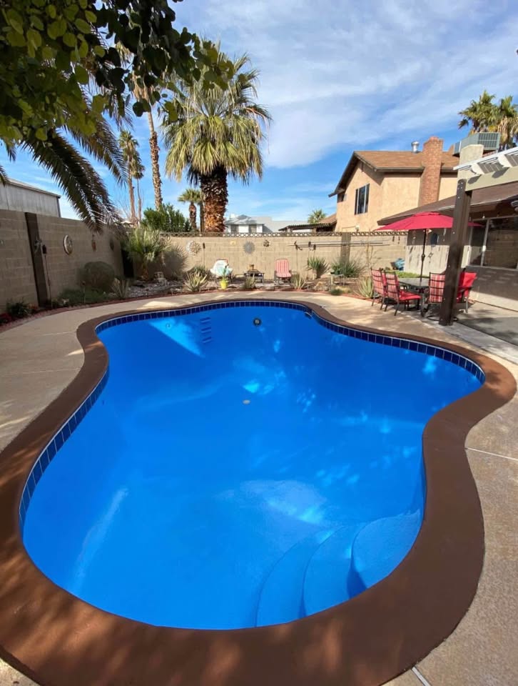 Finished rectangular pool with vibrant blue epoxy finish