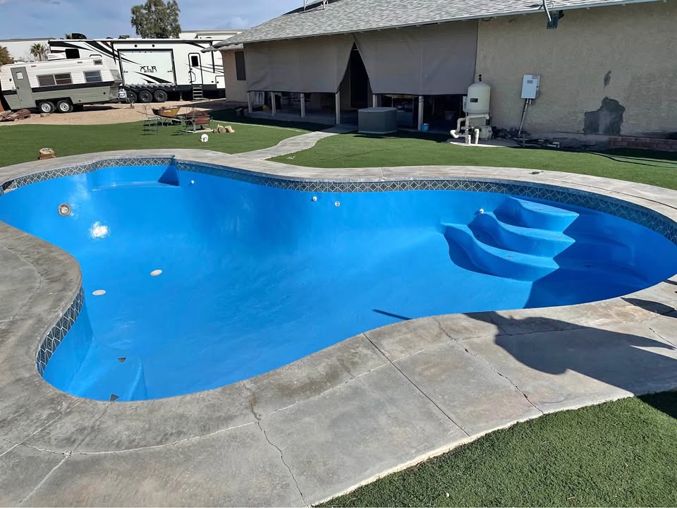 Freeform pool with bright blue epoxy